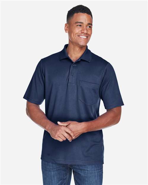 CORE365 Men's Origin Performance Piqué Polo with Pocket — Classic Navy — On model · front