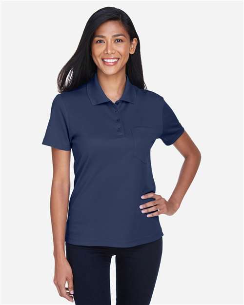 CORE365 Women's Origin Performance Piqué Polo with Pocket — Classic Navy — On model · front