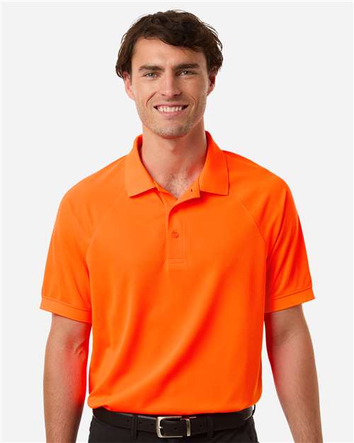 Harriton Men's Charge Snag and Soil Protect Polo — Safety Orange — On model · front