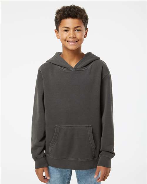 Independent Trading Co. Youth Midweight Pigment-Dyed Hooded Sweatshirt — Pigment Black — On model · front